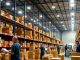 Employees working in a busy Amazon warehouse.