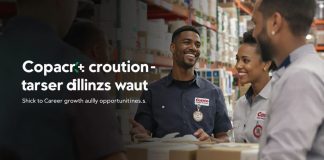 Diverse employees collaborating in a Costco warehouse setting.