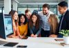 Employers collaborating on job postings in an office setting.