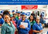 Diverse postal workers collaborating in a busy post office.