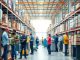 Diverse workers in a busy, organized warehouse environment.