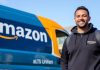 Amazon delivery driver with van in a neighborhood setting.