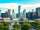 Houston city skyline with people and greenery.